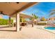 Covered patio with outdoor kitchen and ceiling fan at 1451 E Ivanhoe St, Gilbert, AZ 85295