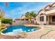 Resort-style backyard with a pool, patio, and basketball hoop at 1451 E Ivanhoe St, Gilbert, AZ 85295