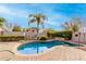 Relaxing kidney-shaped pool with a waterfall feature and basketball court at 1451 E Ivanhoe St, Gilbert, AZ 85295