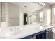 Double vanity bathroom with modern fixtures and large mirror at 15207 W Windward Ave, Goodyear, AZ 85395