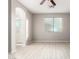 Bedroom with wood-look floors, ceiling fan and en-suite bathroom at 15207 W Windward Ave, Goodyear, AZ 85395