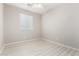 Well-lit bedroom with ceiling fan and window blinds at 15207 W Windward Ave, Goodyear, AZ 85395