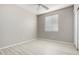 Bright bedroom featuring light walls and wood-look flooring at 15207 W Windward Ave, Goodyear, AZ 85395