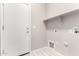 Laundry room with shelving, door, and utility hookups at 15207 W Windward Ave, Goodyear, AZ 85395