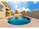 Refreshing blue swimming pool with ample surrounding deck space at 15207 W Windward Ave, Goodyear, AZ 85395