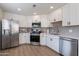 Modern kitchen with stainless steel appliances and white cabinets at 15380 N 100Th St # 1096, Scottsdale, AZ 85260