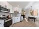 Modern white kitchen with stainless steel appliances at 15380 N 100Th St # 1096, Scottsdale, AZ 85260