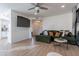 Living area with green sectional sofa and mounted TV at 15380 N 100Th St # 1096, Scottsdale, AZ 85260