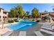 Relaxing community pool area with ample lounge chairs at 15380 N 100Th St # 1096, Scottsdale, AZ 85260