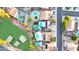 Aerial view of homes, swimming pools, green spaces, and the neighborhood at 15727 W Rimrock St, Surprise, AZ 85374