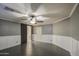 Main bedroom with gray walls and tile floors, plus a barn door to the bathroom at 15727 W Rimrock St, Surprise, AZ 85374