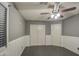 Spacious bedroom featuring double door closets and ceiling fan at 15727 W Rimrock St, Surprise, AZ 85374