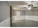 Bedroom with gray walls, white wainscoting, and tile floors at 15727 W Rimrock St, Surprise, AZ 85374