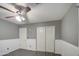 Bedroom with ceiling fan, double closets and tile floors at 15727 W Rimrock St, Surprise, AZ 85374