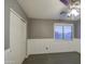 Well-lit bedroom with a large closet and tile floors at 15727 W Rimrock St, Surprise, AZ 85374