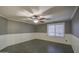 Bright bedroom featuring gray walls, white wainscoting, and tile floors at 15727 W Rimrock St, Surprise, AZ 85374