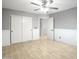 Bedroom featuring tile floors, a ceiling fan, fresh paint, updated trim work, and a closet at 15727 W Rimrock St, Surprise, AZ 85374