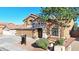 Beautiful two-story home with a three-car garage and nicely landscaped yard with desert landscaping at 15727 W Rimrock St, Surprise, AZ 85374