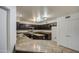 Modern kitchen with dark cabinets and granite countertops at 15727 W Rimrock St, Surprise, AZ 85374