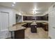 Kitchen boasts dark wood cabinets and granite countertops at 15727 W Rimrock St, Surprise, AZ 85374