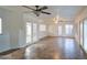 Bright living room with tile floors and ceiling fan at 15727 W Rimrock St, Surprise, AZ 85374