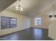 Spacious living room with high ceilings and dark tile floors at 15727 W Rimrock St, Surprise, AZ 85374