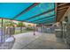 Covered patio with built-in BBQ and artificial turf at 15727 W Rimrock St, Surprise, AZ 85374