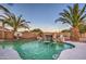 Luxury pool with a stone waterfall and a basketball hoop nearby at 15727 W Rimrock St, Surprise, AZ 85374