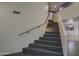 Modern staircase with dark tile and metal railing at 15727 W Rimrock St, Surprise, AZ 85374