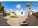 Backyard features artificial turf, fire pit, and gravel at 16230 N 35Th Way, Phoenix, AZ 85032