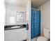 Bathroom with shower/tub combo and blue tile at 16230 N 35Th Way, Phoenix, AZ 85032