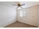 Small bedroom with ceiling fan and carpeted floor at 16230 N 35Th Way, Phoenix, AZ 85032