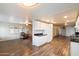 Modern kitchen with white cabinets, granite countertops, and wood floors at 16230 N 35Th Way, Phoenix, AZ 85032