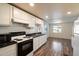 White kitchen cabinets and granite countertops in an open floor plan at 16230 N 35Th Way, Phoenix, AZ 85032