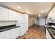 Updated kitchen featuring white cabinets and granite countertops at 16230 N 35Th Way, Phoenix, AZ 85032