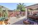 Landscaped backyard with cactus plants and a fire pit at 17065 N Silver Path, Surprise, AZ 85374