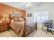 Bedroom with a wooden bed frame and a work area at 17065 N Silver Path, Surprise, AZ 85374