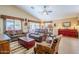 Relaxing living room featuring comfortable leather sofas and wood flooring at 17065 N Silver Path, Surprise, AZ 85374