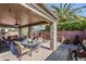 Covered patio with outdoor dining and seating areas at 17065 N Silver Path, Surprise, AZ 85374