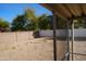 Gravel backyard with covered patio and trees at 17407 N Country Club N Dr, Sun City, AZ 85373