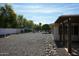 Landscaped backyard with a pergola and rock pathway at 17407 N Country Club N Dr, Sun City, AZ 85373