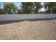 Gravel backyard with two circular areas and a block wall at 17407 N Country Club N Dr, Sun City, AZ 85373