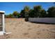 Large backyard with gravel landscaping and a block wall at 17407 N Country Club N Dr, Sun City, AZ 85373