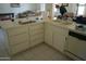 Kitchen with double sink, dishwasher, and an island at 17407 N Country Club N Dr, Sun City, AZ 85373