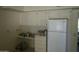 Kitchen with white refrigerator and ample counter space at 17407 N Country Club N Dr, Sun City, AZ 85373