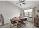 Bright dining area with wooden table and seating for six at 17600 N 64Th Dr, Glendale, AZ 85308