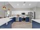 Modern kitchen with stainless steel appliances and blue cabinetry at 17600 N 64Th Dr, Glendale, AZ 85308