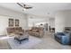 Open living room with a view into the kitchen and seating area at 17600 N 64Th Dr, Glendale, AZ 85308