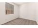 Small carpeted bedroom with a window providing natural light at 18219 W Hess St, Goodyear, AZ 85338
