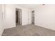 Spacious bedroom with carpet and access to en-suite bathroom and walk-in closet at 18219 W Hess St, Goodyear, AZ 85338